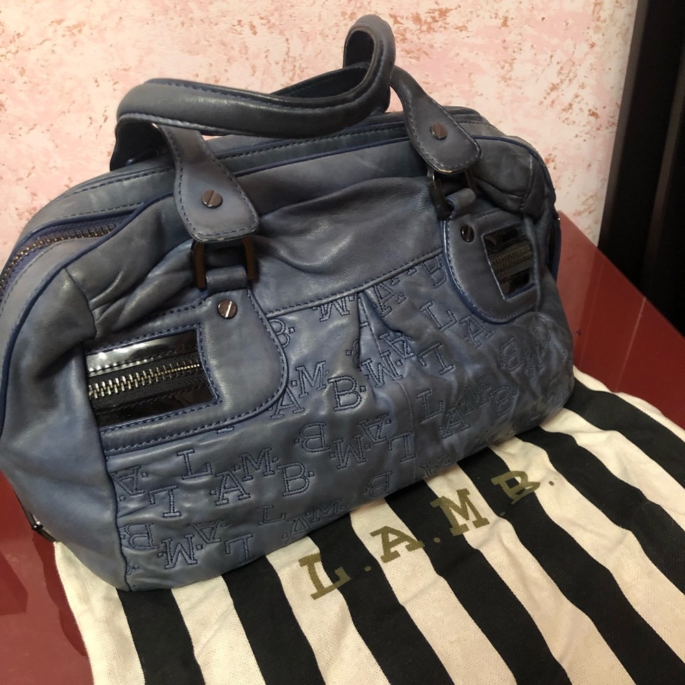 L.A.M.B. Handbag with branded tote for storage